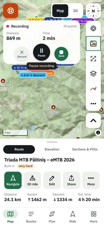 Recording a ride on a phone — the live distance and time on the map, with pause and save